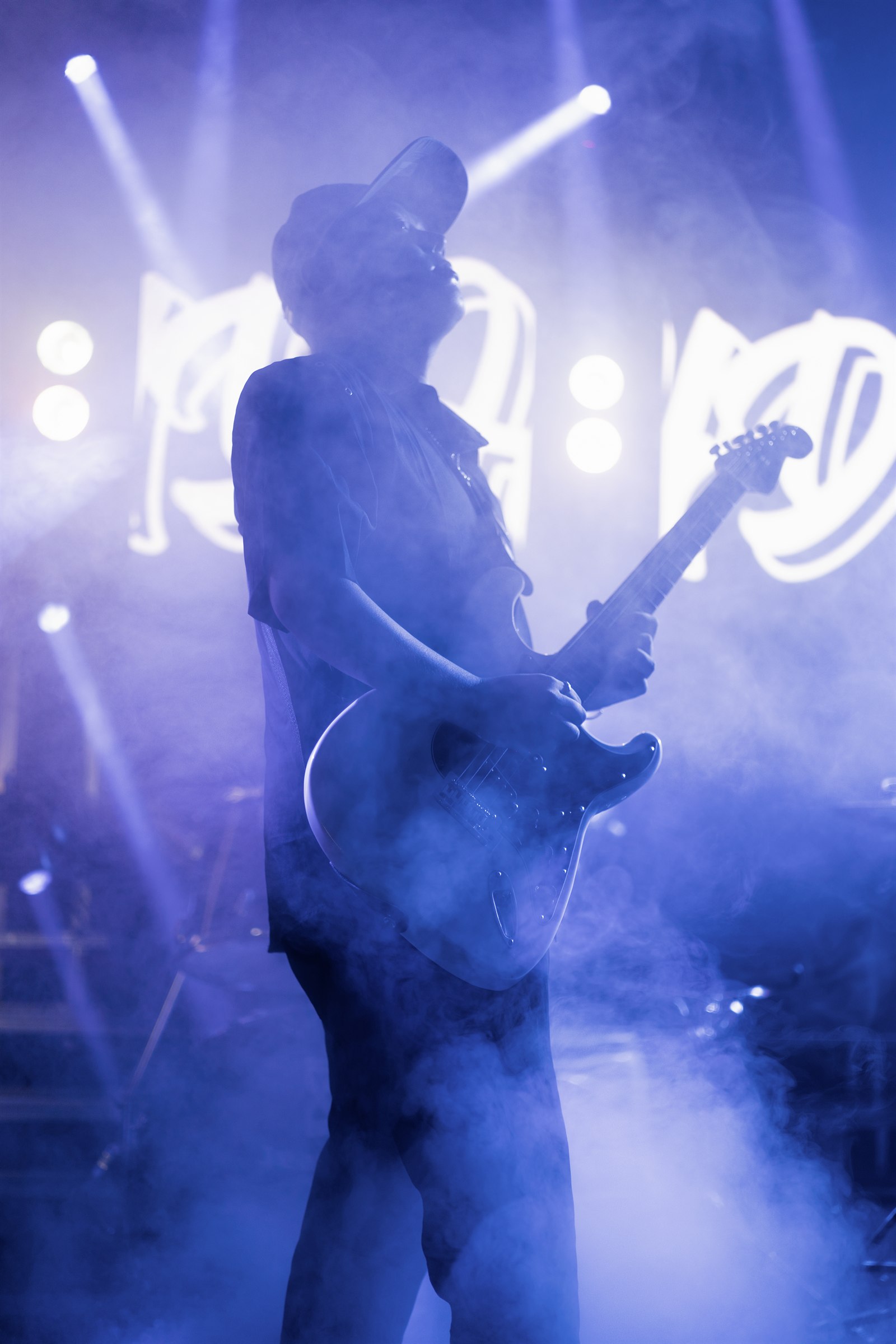Jimmy Wei playing guitar on stage
